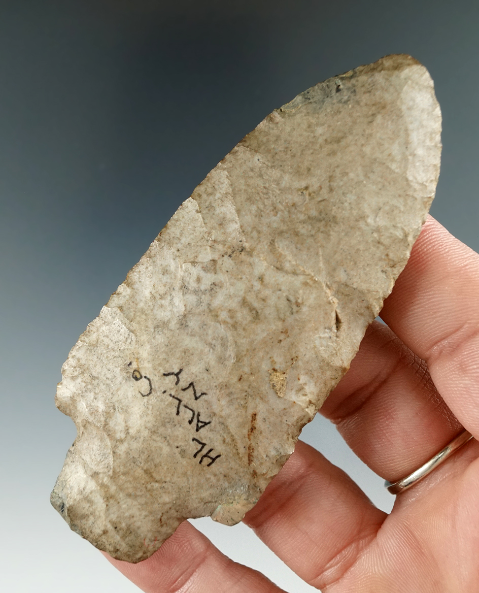 3 5/8" Adena with restoration to one blade ding near tip found in Allegheny Co., New York.