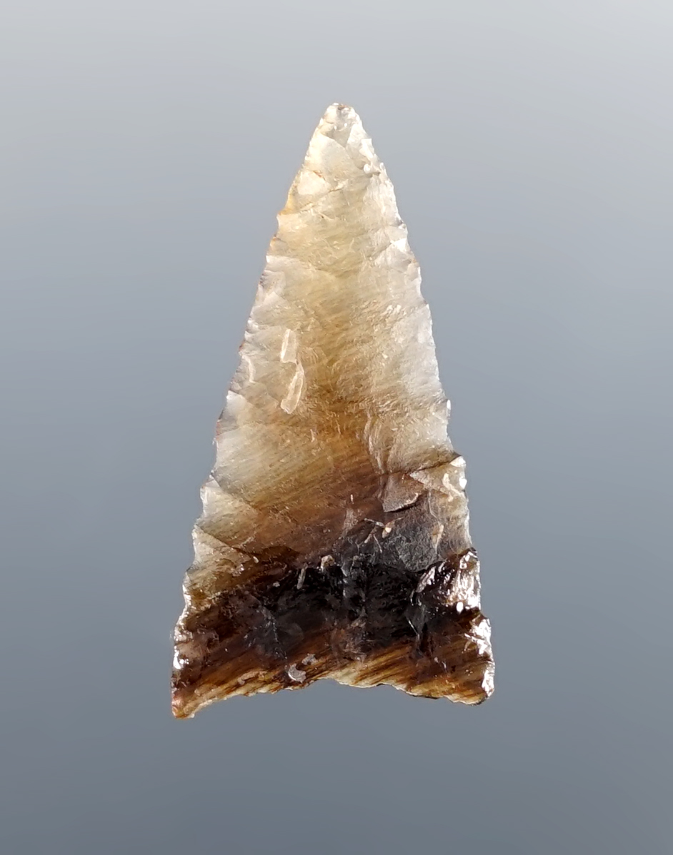 Fine flaking on this 1 1/8" Triangle Point made from striped Agate. Found in North Dakota.