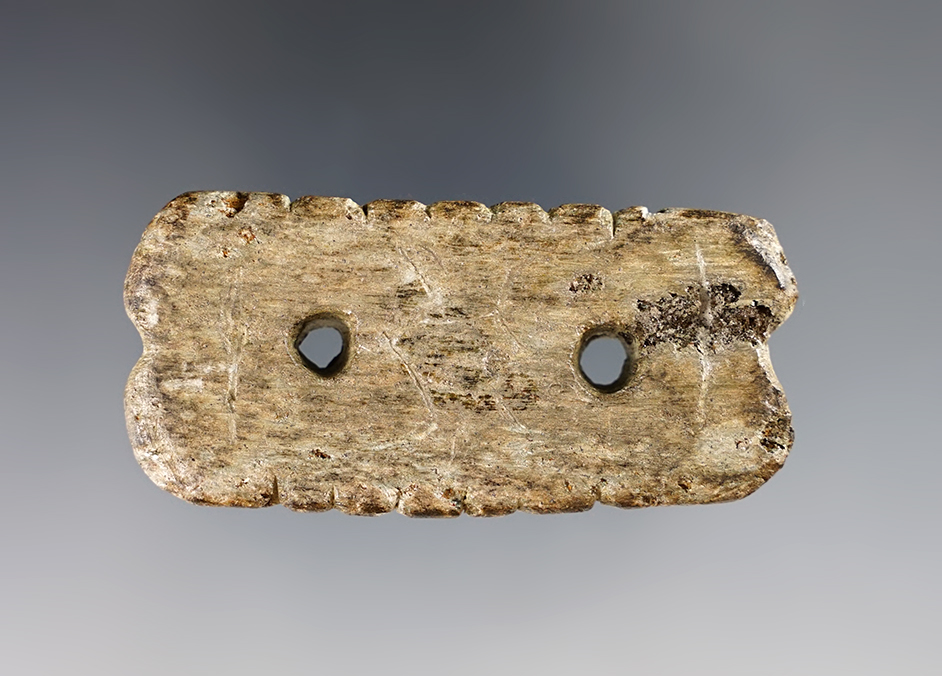 Well patinated 2 9/16" heavily tallied Steatite Gorget found in Ohio. Ex. Hooks, Teill collections. 