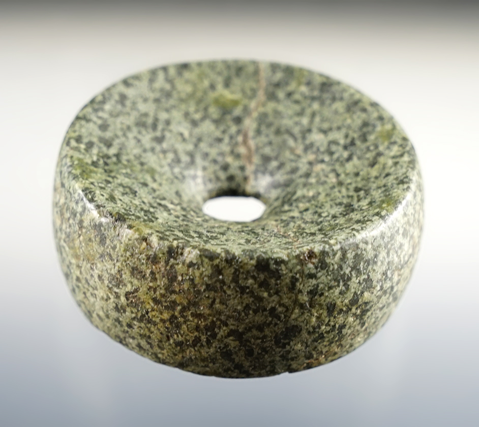 2" diameter Perforated Discoidal made from speckled Granite. Found in Northern Illinois.