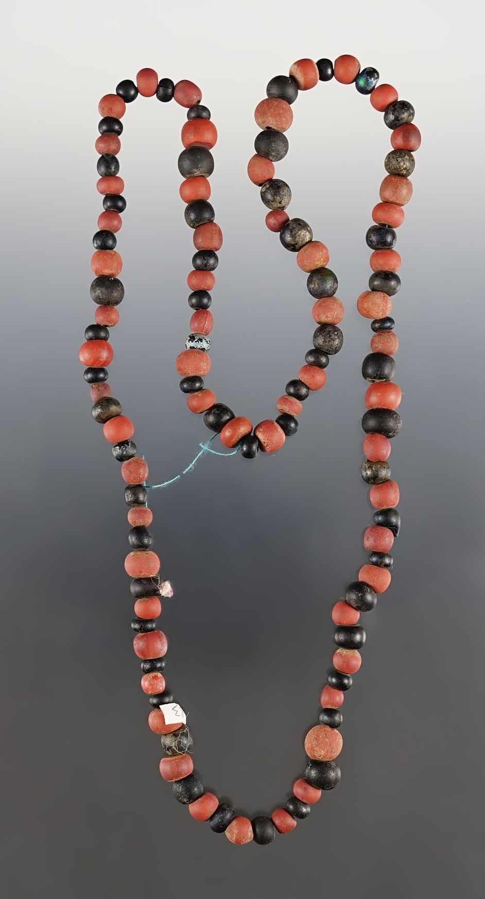 22" Strand of black Round and Redwood Beads. Recovered at the White Springs Site, New York. 