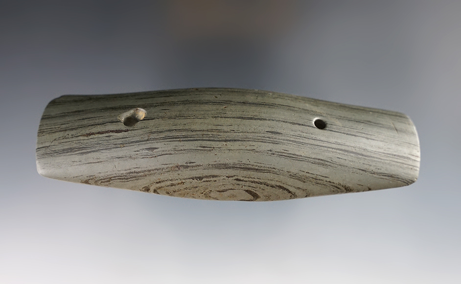 4 5/8" Hopewell Gorget that is slightly scooped on the bottom. Found in Decatur Co, Indiana. 