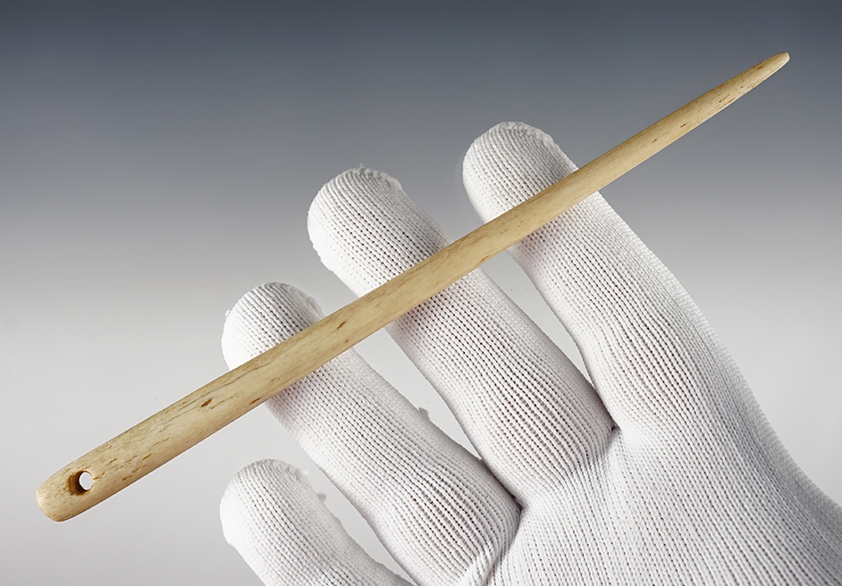 Fine 6 5/8" Bone Needle that is drilled. Found in Kentucky.