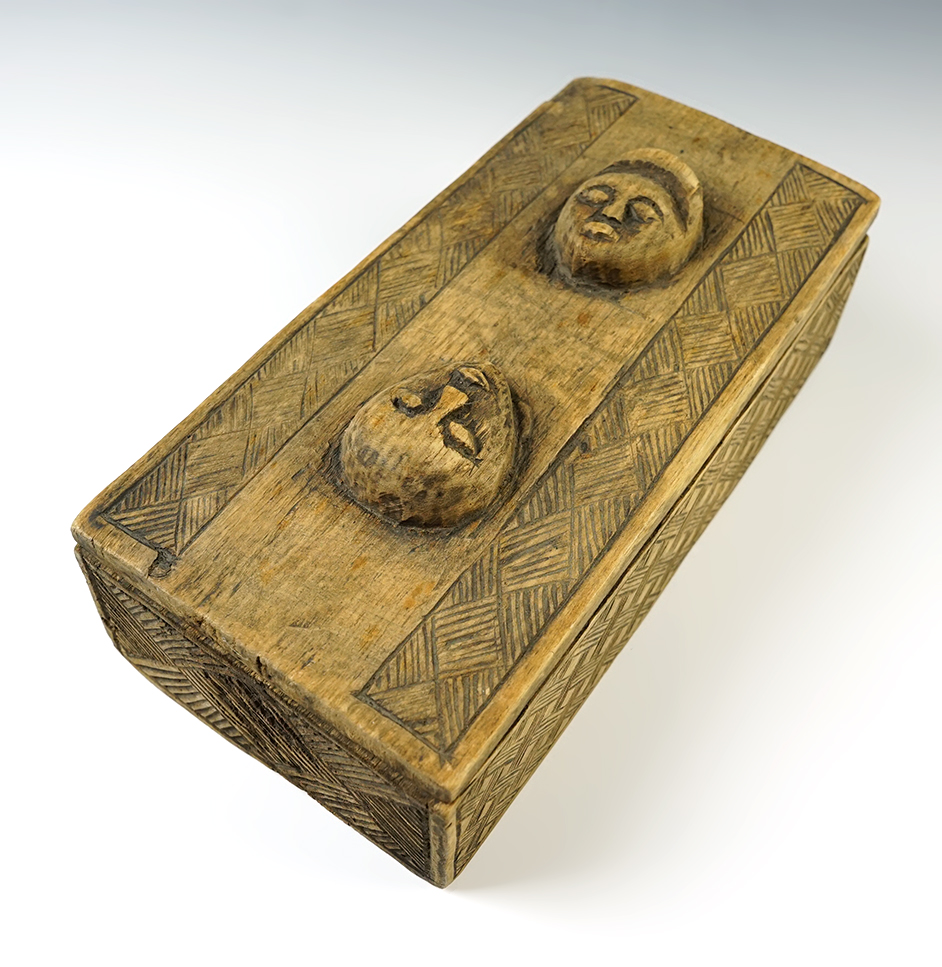 Vintage hand-carved wooden box with lid, very detailed engravings on surface. 9" long.