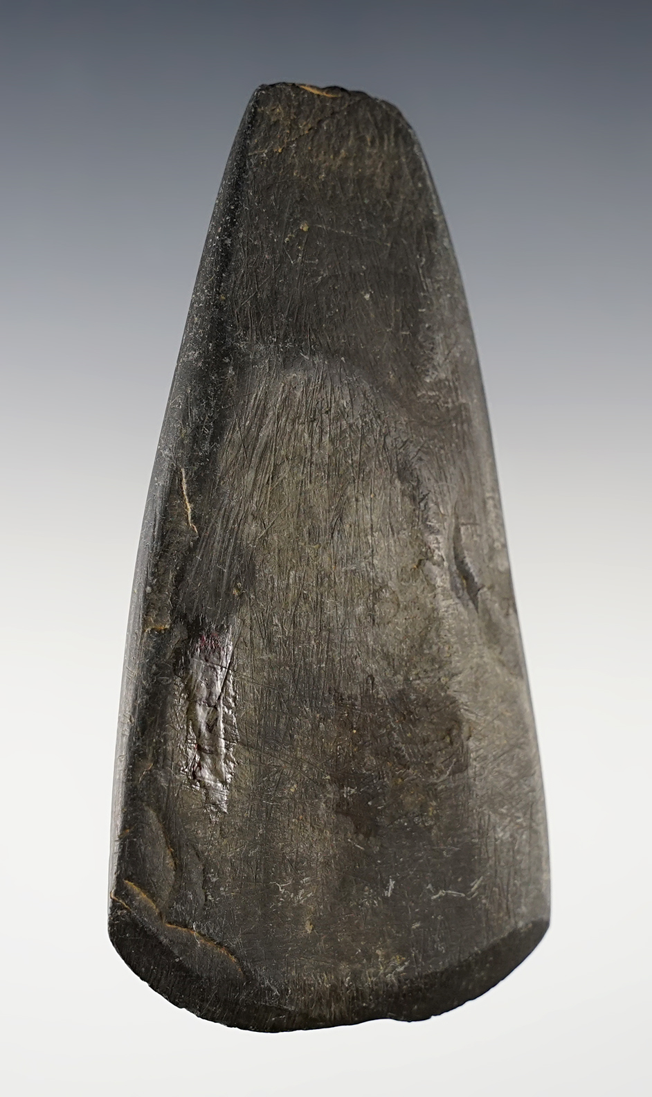 3 15/16" Slate Celt that is well patinated. Found in Ohio.