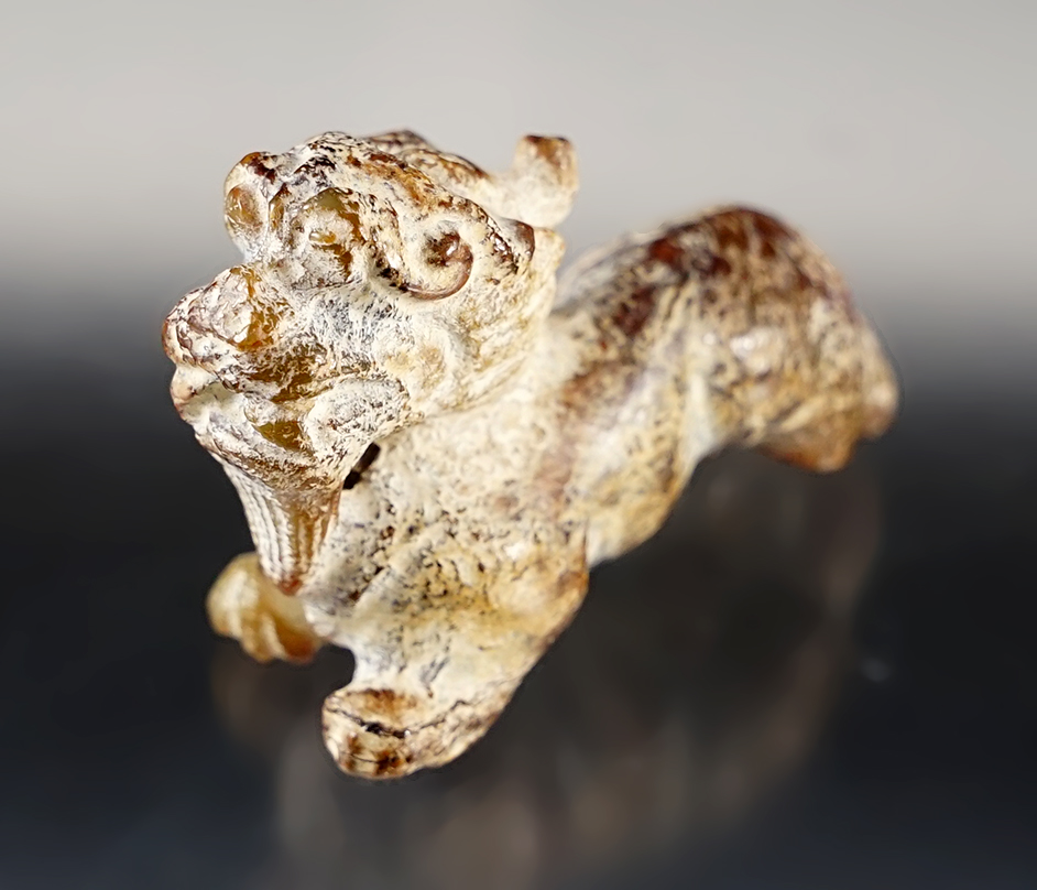 Nicely patinated 2 1/4" long well carved Jade ainmal effigy. Exact age unknown. China. 