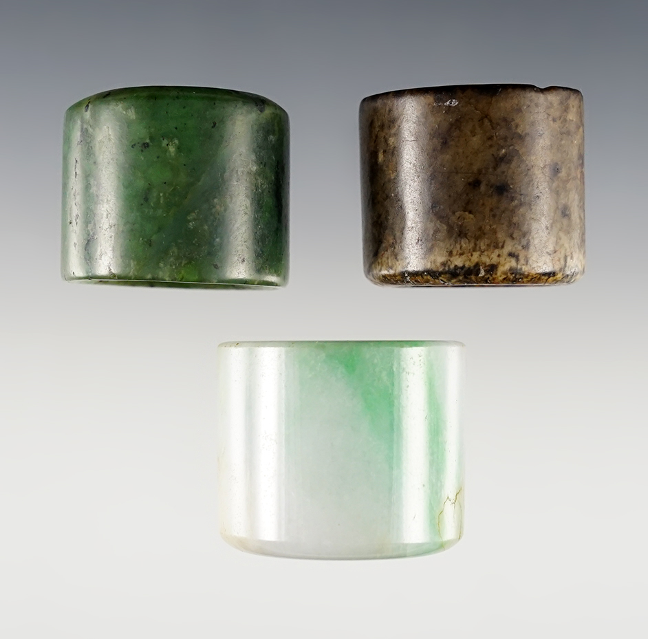 Set of 3 vintage Chinese Jade Rings. Exact age unknown. Largest is 1 3/8".