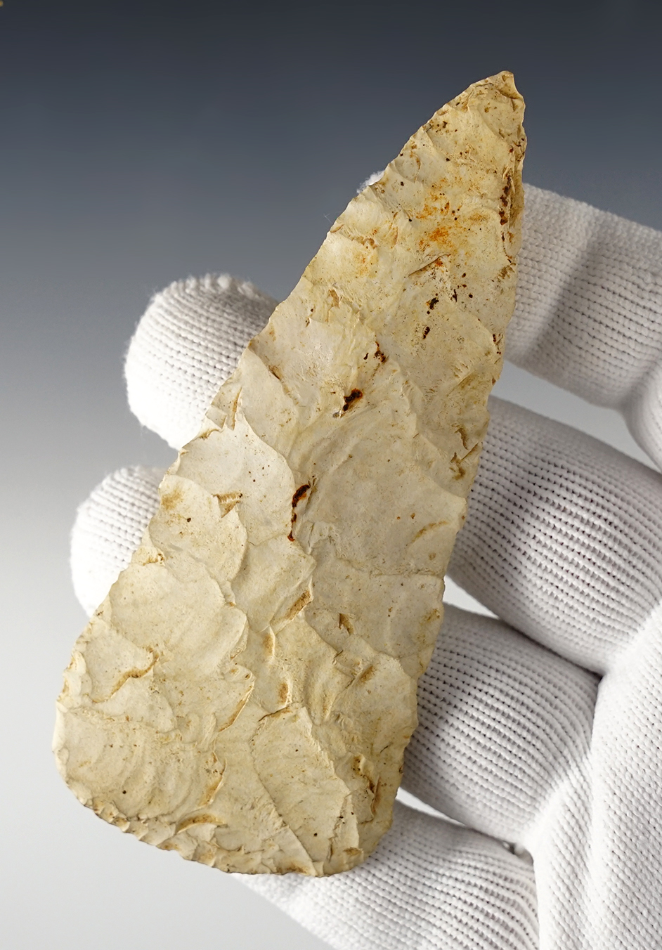 4 1/8" Triangular Knife made from heavily patinated flint with nice mineral deposits on the surface. Found in Ohio.