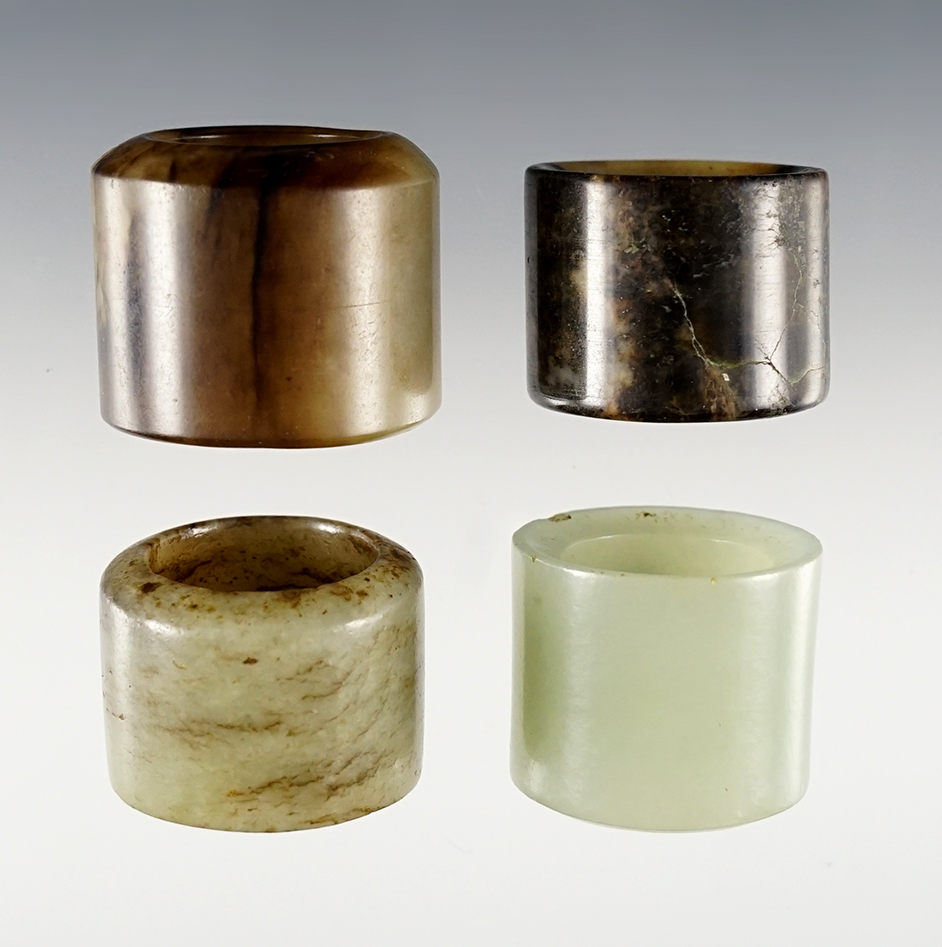 Set of 4 vintage Chinese Jade Rings. Exact age unknown. Largest is 1 1/4".
