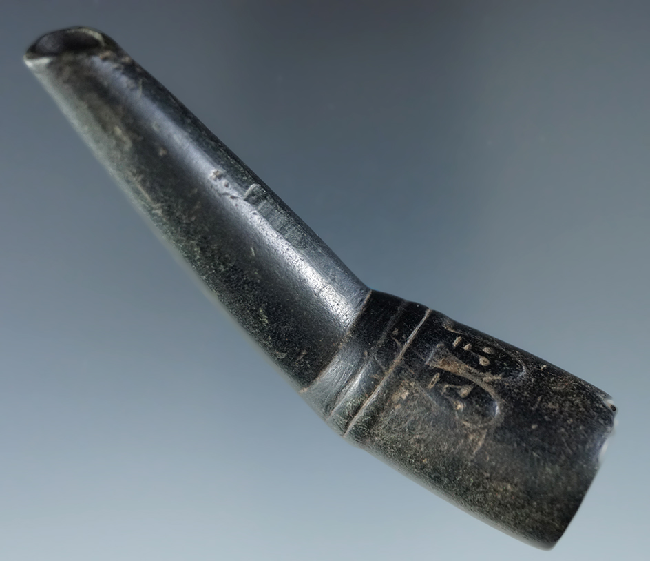 3 1/2" Black Steatite proto-Iroquois Obtuse Angle Pipe with human motifs found in New York.