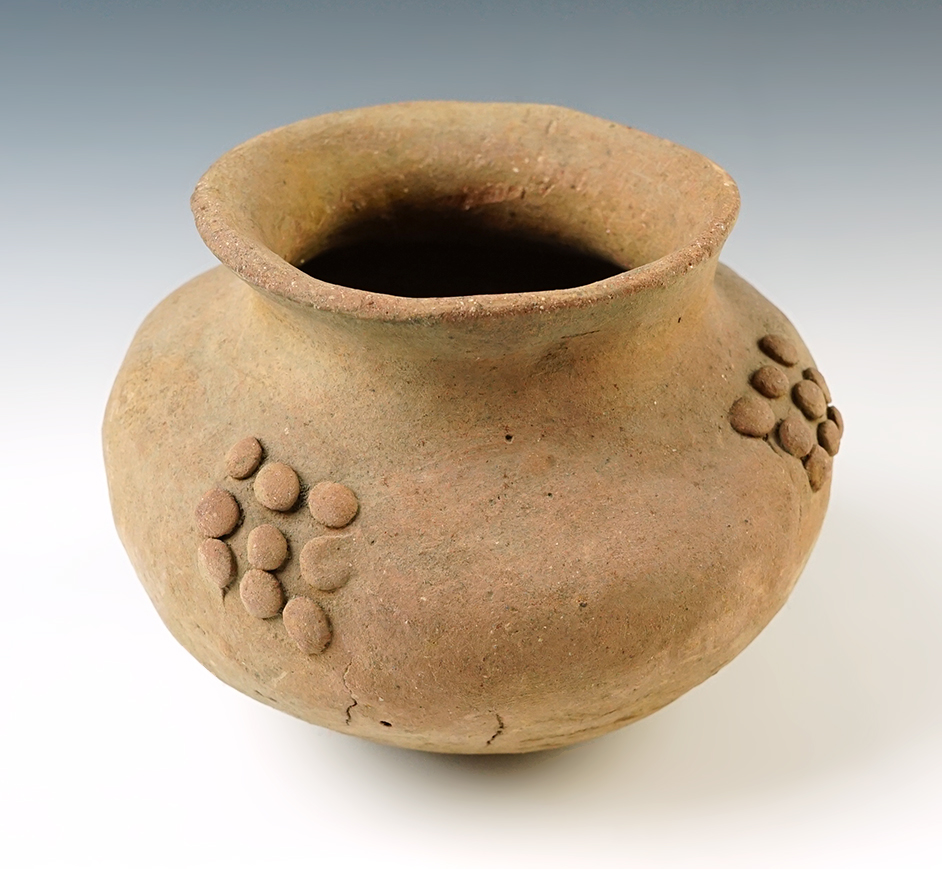 5 1/2" x 4 1/4" ancient decorated pottery vessel from Southeast Asia. A couple pressure cracks.
