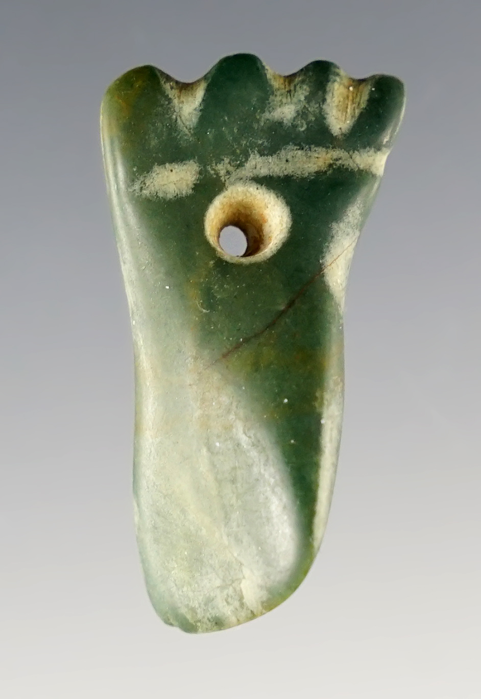 1 1/4" Effigy bead, Costa Rica, 300-700 CE. Made from green Jasper. Made from a larger object.