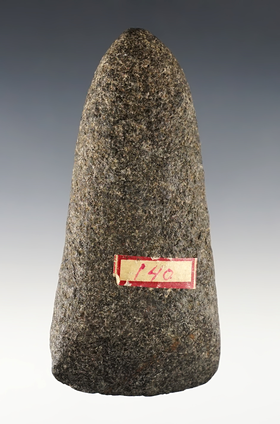 4 1/8" Hardstone Celt with very heavy polish to the bit area. Found in the Ohio/Indiana area.