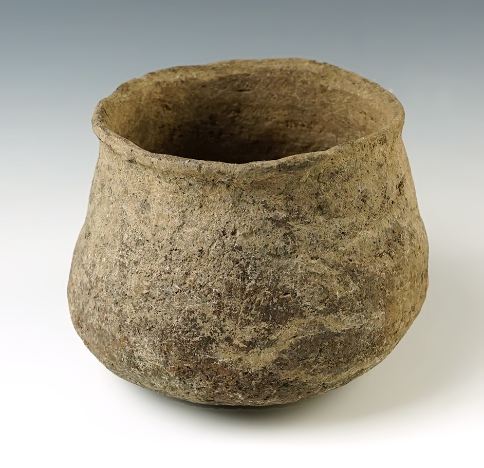 4 3/8 " wide x 3 1/2 " tall pottery jar in solid condition. Excellent age on surface. 