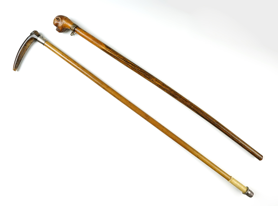 Pair of vintage miniature canes. One has a silver band that is stamped "KGB April 27, 1918."