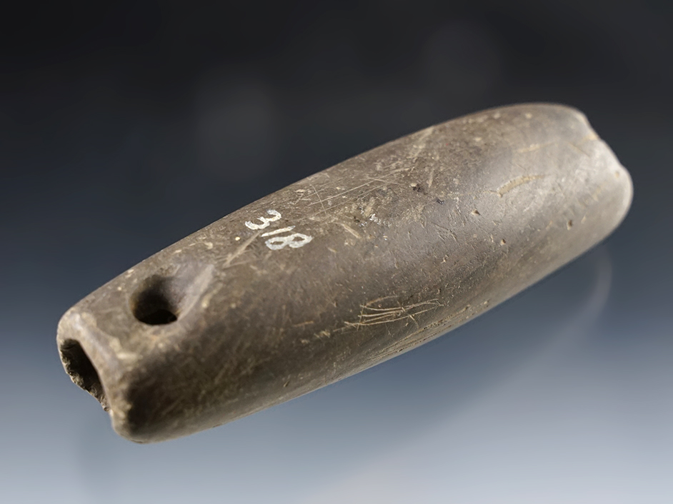 4 1/8" Tubular Bannerstone with unique secondary perforations at both ends. Well patinated.