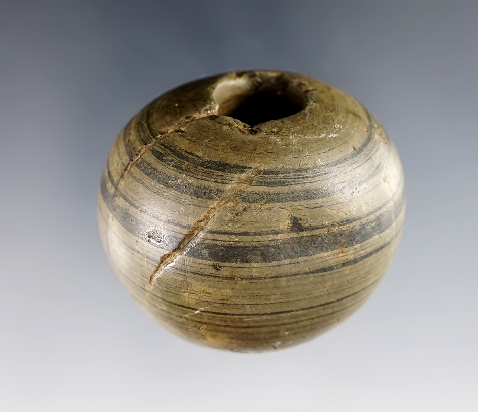 1 3/4" Fluted Ball Bannerstone found in Ohio that is very nicely patinated. Banded Glacial Slate. 