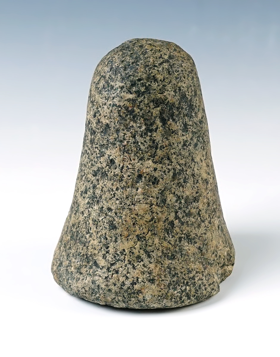 4" tall Ohio Pestle made from patinated material with a well polished divot on the base.