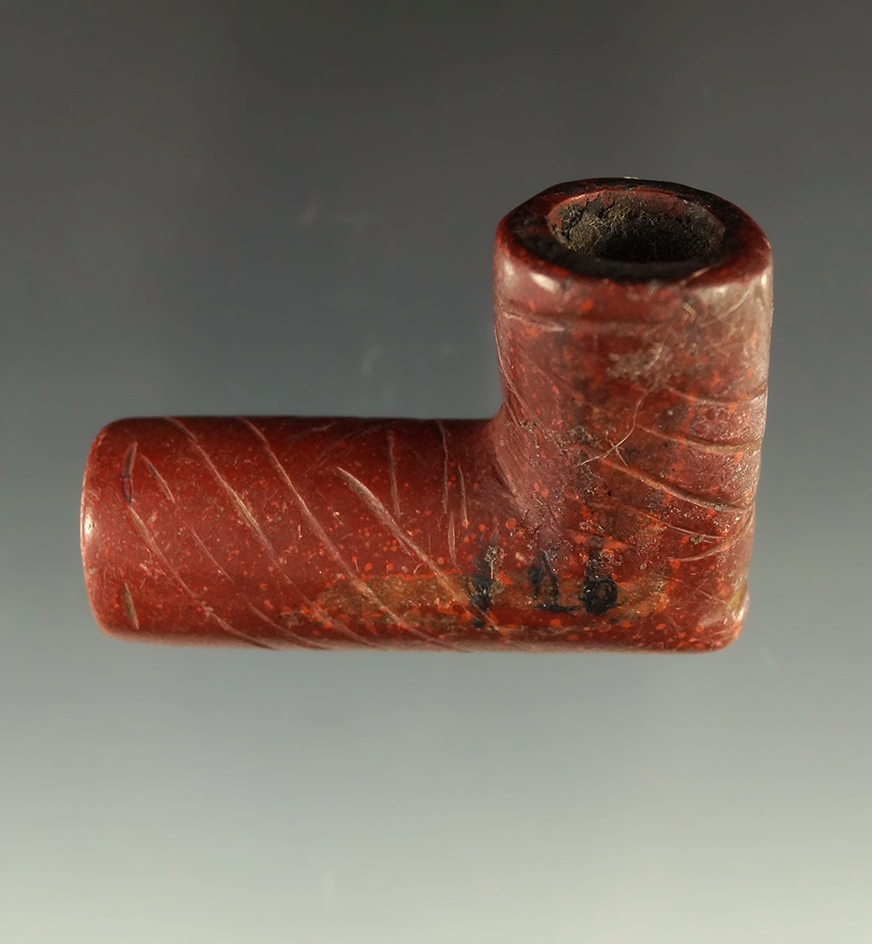 Nice engravings on this 1 13/16" heavily patinated early Catlinite Pipe. Ex. Lewis Eulert collection