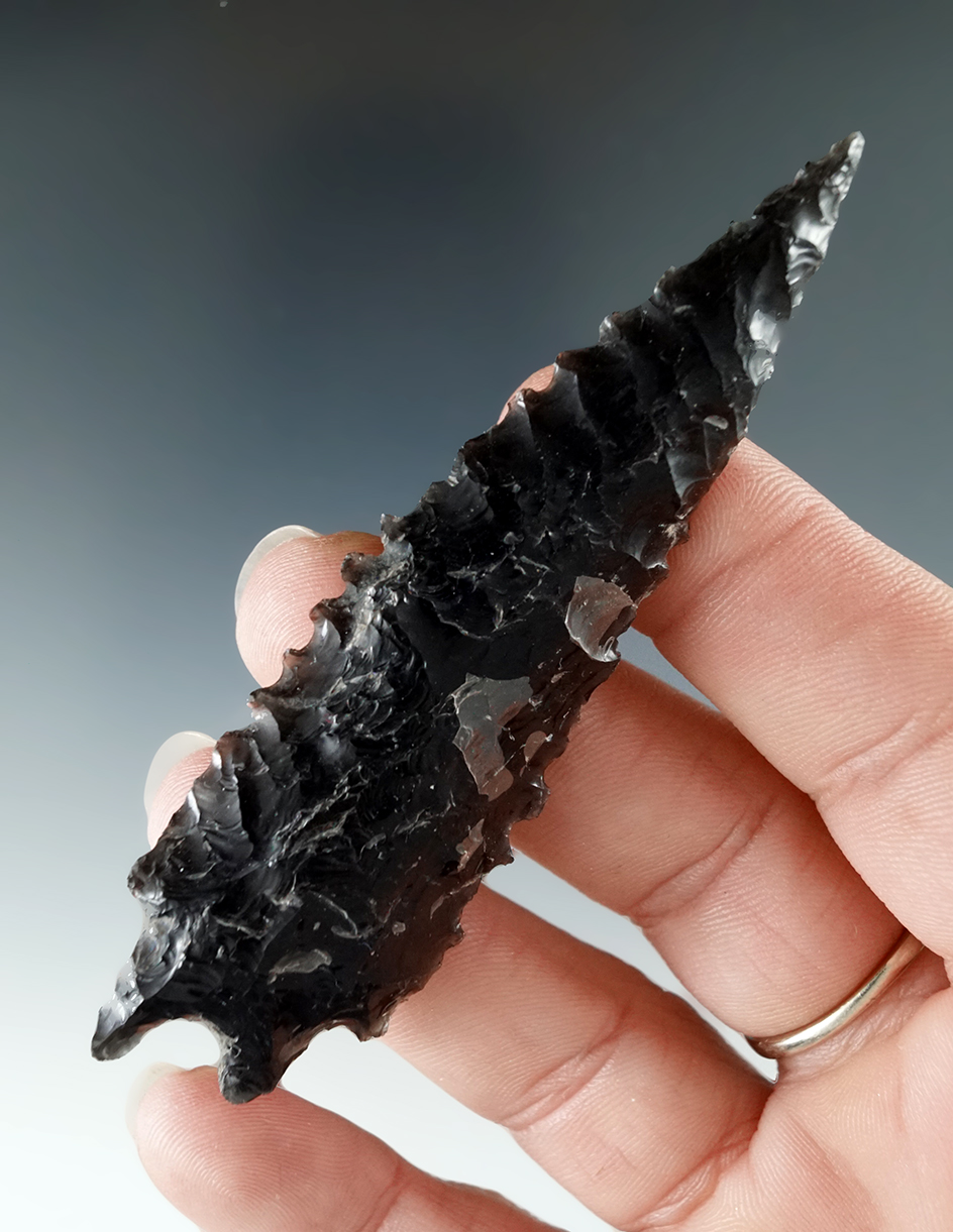 Large, heavily serrated 3 3/8" large Pinto Basin made from obsidian found in Lake County Oregon.