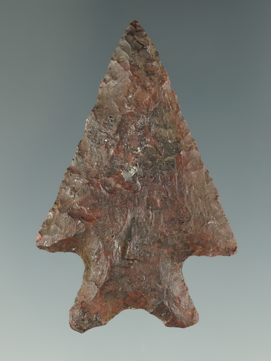 Large for type! 2 1/16" Snake River Dart Point that is heavily patinated. Columbia River.