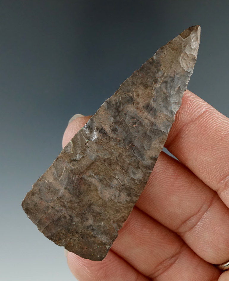 2 11/16" thin and well flaked triangular point made from Onondaga Flint found in New York.