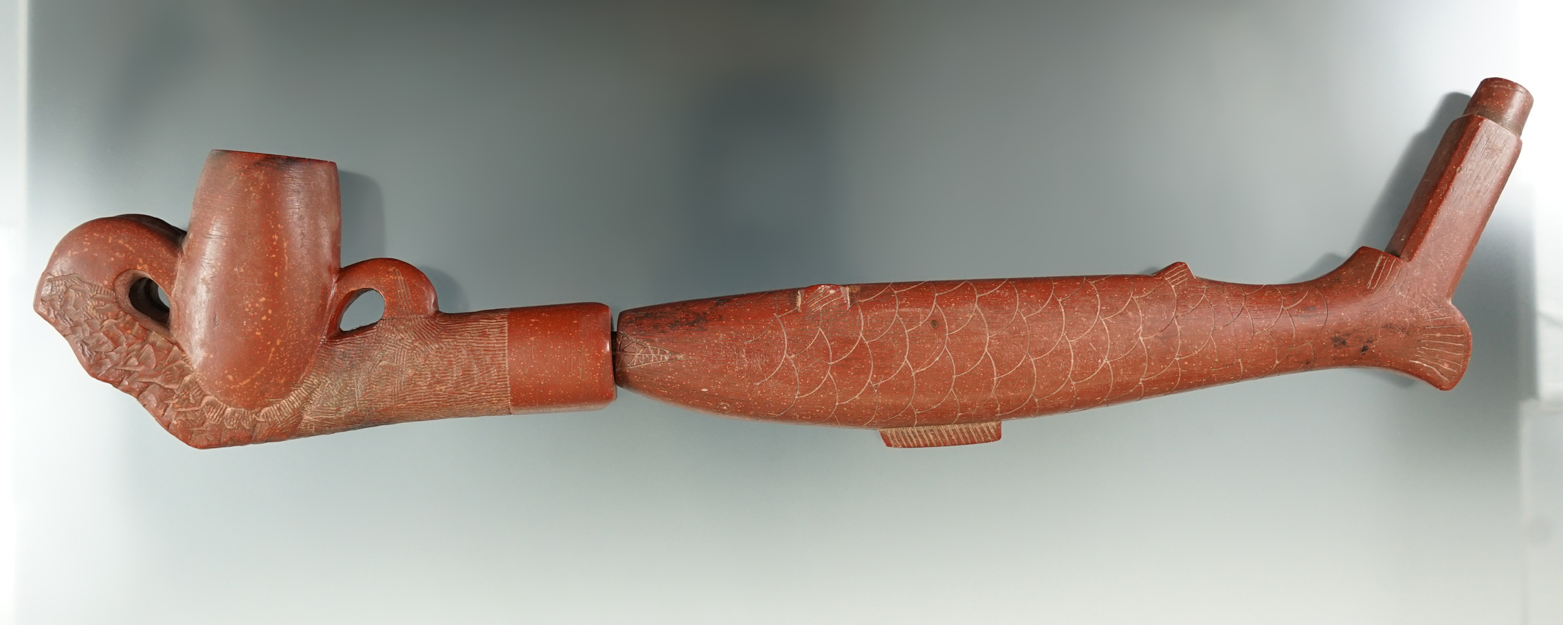 Pictured! Catlinite Plains Pipe with a fish effigy stem and eagle claw bowl, circa 1870-1910.