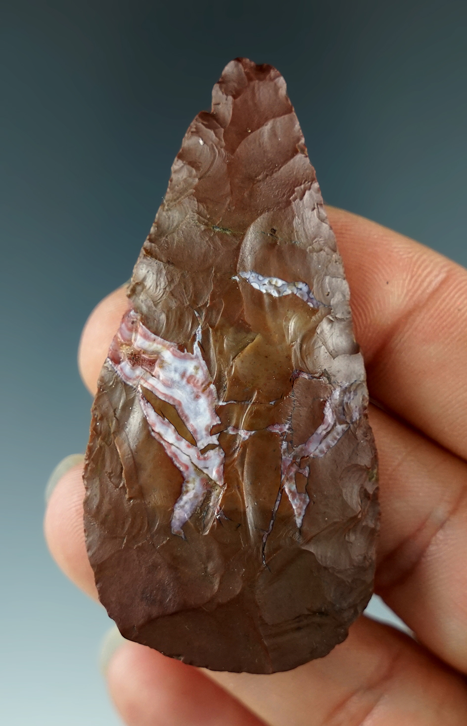 2 1/2" Jasper Knife with a scraper and found near the Columbia River.