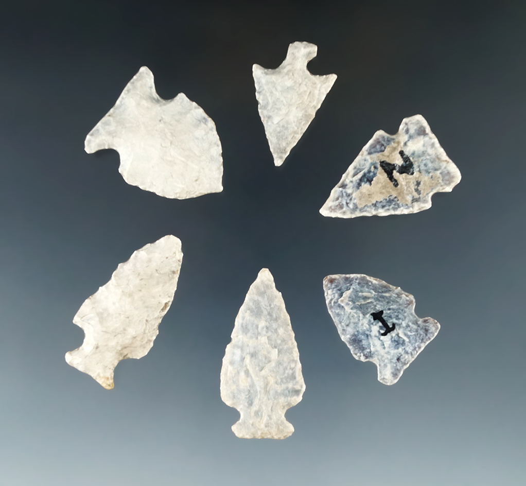 Set of six highly patinated arrowheads found in the Dakotas, largest is 1 1/2".