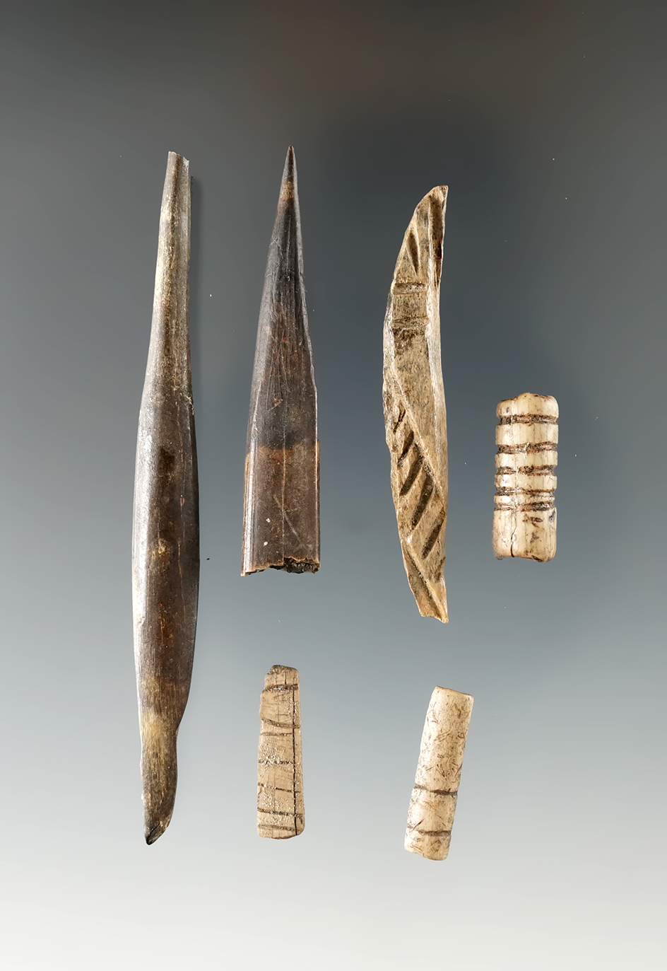 Group of damaged bone artifacts found near the Columbia River, some show great incised design