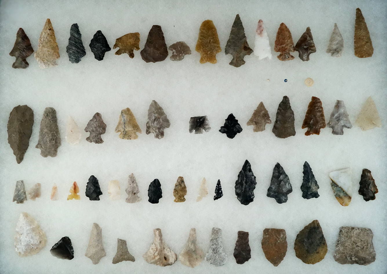 Large group of 54 assorted artifacts from various different areas, largest is 2 1/8".