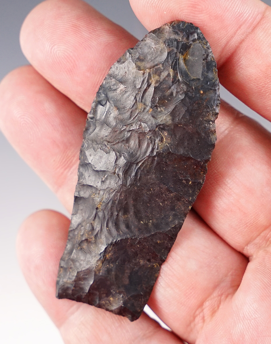 2 5/8" well flaked Paleo Lanceolate with ancient grinding to base area. Found in Huron Co., Ohio.