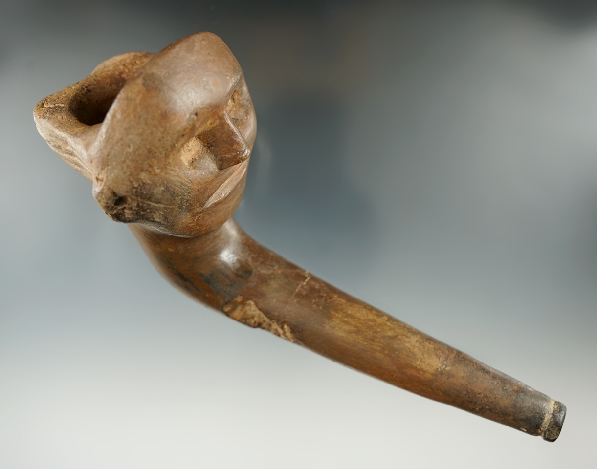 Large 6 3/16" long Iroquois face effigy pipe with restoration. Found in New York.
