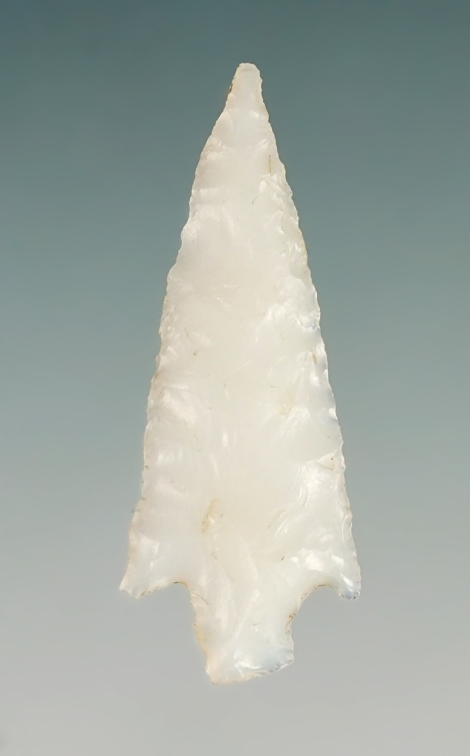 1 1/8" Stemmed point with excellent flaking. Found in the Four Corners area of the U.S.