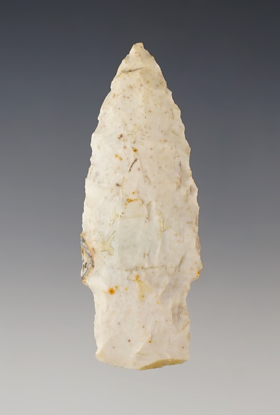 Nicely styled 2 9/16" archaic stemmed dart point found in the Midwest.