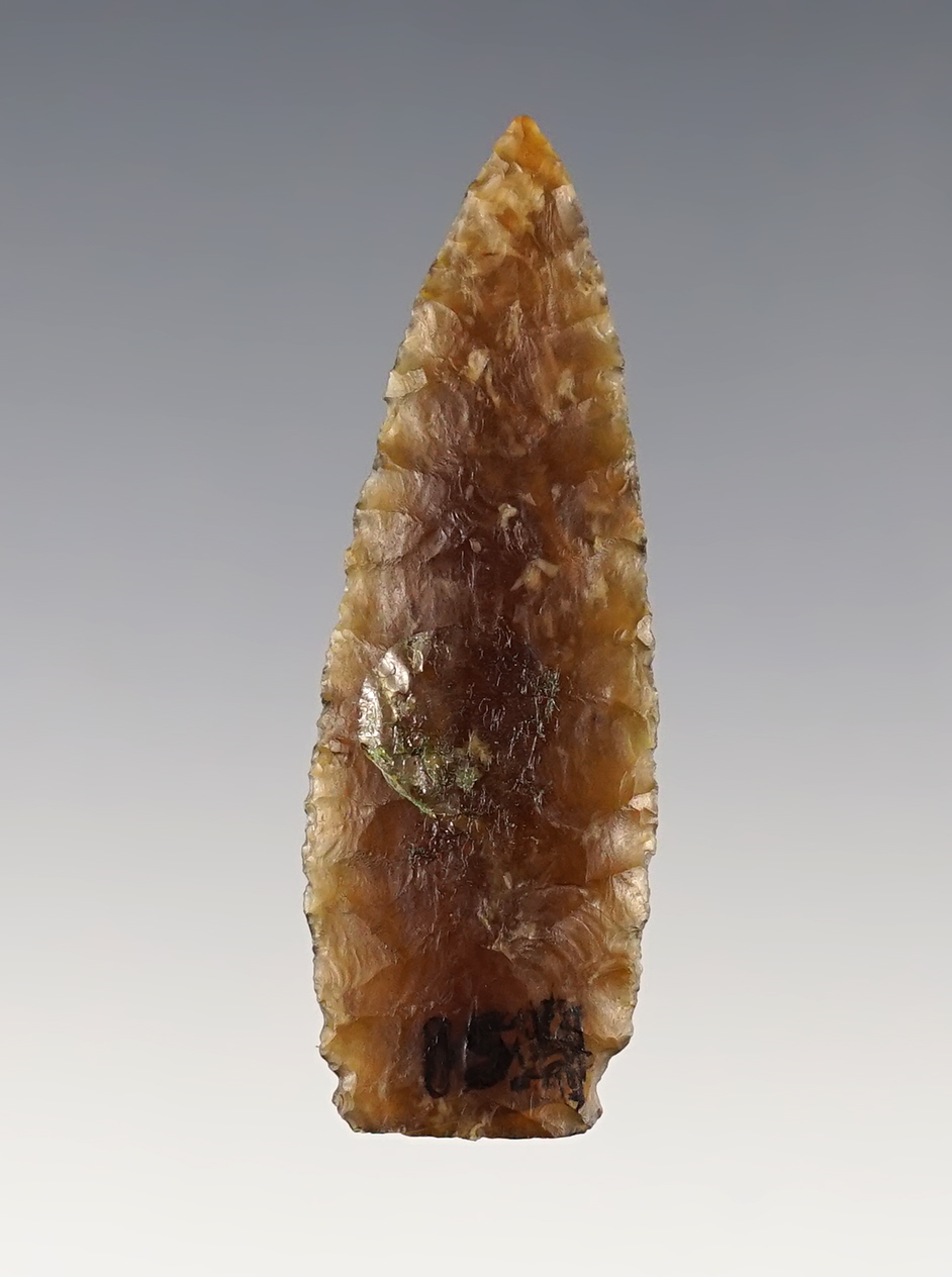 Parallel flaked 2 1/16" Paleo Lanceolate with slight side notches. Made from Knife River Flint. 