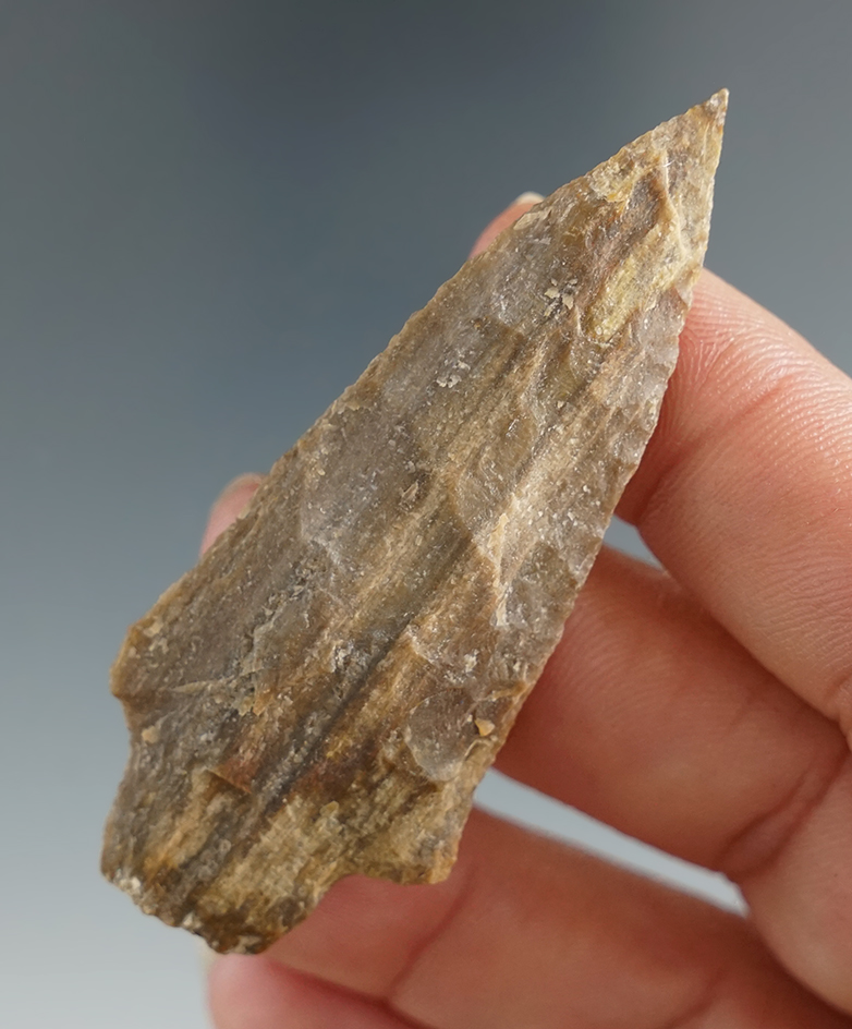 2 7/16" stemmed dart point made from petrified wood found in Texas.